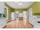 Spacious kitchen area with ample cabinet space and tile floor at 4461 Vrain St, Denver, CO 80212