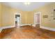 Living room featuring hardwood floors and doorways leading into other rooms at 4461 Vrain St, Denver, CO 80212