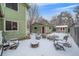 Backyard with storage sheds and snow-covered patio at 9336 Pierce St, Westminster, CO 80021