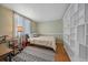 Bedroom with built-in shelving and a full-size bed at 9336 Pierce St, Westminster, CO 80021