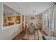 Bright dining area with kitchen access and a view of the backyard at 9336 Pierce St, Westminster, CO 80021