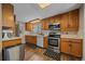 Well-equipped kitchen with stainless steel appliances and oak cabinetry at 9336 Pierce St, Westminster, CO 80021