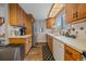 Bright kitchen features wood cabinets, stainless steel appliances, and a tile backsplash at 9336 Pierce St, Westminster, CO 80021