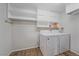 Laundry room with washer, dryer, and ample shelving at 9336 Pierce St, Westminster, CO 80021