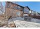 Backyard patio features stone and siding exterior and outdoor seating at 25123 E 5Th Ave, Aurora, CO 80018