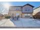 Backyard patio features stone and siding exterior and outdoor seating at 25123 E 5Th Ave, Aurora, CO 80018