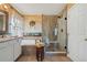 Stylish bathroom features a glass shower, double sink vanity, and a soaking tub at 25123 E 5Th Ave, Aurora, CO 80018