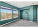 A serene bedroom bathed in natural light, featuring a large window and ample closet space at 25123 E 5Th Ave, Aurora, CO 80018