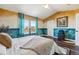 Vaulted ceiling bedroom with picture window features stylish accent walls and hardwood floors at 25123 E 5Th Ave, Aurora, CO 80018