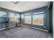 Bedroom with gray carpet, ample natural light from the windows, and a cozy atmosphere at 25123 E 5Th Ave, Aurora, CO 80018