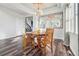 Elegant dining room featuring hardwood floors, a chandelier, and refined décor at 25123 E 5Th Ave, Aurora, CO 80018