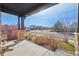 Inviting front porch featuring brick columns and providing a pleasant outdoor seating area at 25123 E 5Th Ave, Aurora, CO 80018