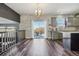 Spacious kitchen area featuring stone countertops, gray cabinets, wood-style flooring and a sliding glass door at 25123 E 5Th Ave, Aurora, CO 80018