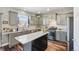 Well-lit kitchen featuring stainless steel appliances, light countertops, and a center island at 25123 E 5Th Ave, Aurora, CO 80018