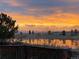 Sunset view from backyard, overlooking pond and mountains at 25123 E 5Th Ave, Aurora, CO 80018