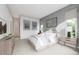 Bright bedroom with a queen-size bed and large windows at 2165 Grayside Cir, Castle Rock, CO 80109