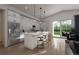 Modern kitchen with white cabinets, island, and stainless steel appliances at 2165 Grayside Cir, Castle Rock, CO 80109