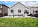Backyard with patio and lush, green lawn at 26787 E Maple Ave, Aurora, CO 80018