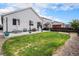 Backyard with patio and lush, green lawn at 26787 E Maple Ave, Aurora, CO 80018
