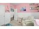 Bright bedroom with an armchair, area rug and neutral-toned furniture at 26787 E Maple Ave, Aurora, CO 80018