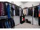 Spacious walk-in closet with organized hanging racks and shelving for clothes, shoes, and accessories at 26787 E Maple Ave, Aurora, CO 80018