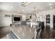 Spacious open-concept living area featuring modern kitchen, dining area, and comfortable living room at 26787 E Maple Ave, Aurora, CO 80018