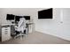 Modern home office with a sleek desk, multiple monitors, and minimalist design elements for productivity at 26787 E Maple Ave, Aurora, CO 80018