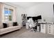 Bright home office with a large window, comfortable seating, and a functional workspace setup at 26787 E Maple Ave, Aurora, CO 80018