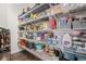 Well-organized walk-in pantry with ample shelving and storage space for food and kitchen essentials at 26787 E Maple Ave, Aurora, CO 80018