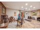 Spacious basement featuring a fireplace, wood flooring, and access to the outdoors at 12173 W 27Th Dr, Lakewood, CO 80215