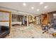 Spacious basement featuring a sitting area, exercise area, and massage table at 12173 W 27Th Dr, Lakewood, CO 80215