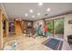 Basement area features a fireplace, a staircase and an exercise area at 12173 W 27Th Dr, Lakewood, CO 80215