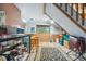 Open basement with a bar, storage, wooden beams and access to the stairs at 12173 W 27Th Dr, Lakewood, CO 80215
