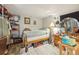 Cluttered bedroom with a double bed, closet and wooden floors at 12173 W 27Th Dr, Lakewood, CO 80215