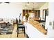 Cozy living room with hardwood floors, comfortable seating, and custom wood countertop dining at 12173 W 27Th Dr, Lakewood, CO 80215