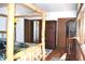 Bright main bedroom with a wooden bed frame, closet, and hardwood floors at 12173 W 27Th Dr, Lakewood, CO 80215