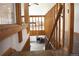 Carpeted stairs with wooden railings lead to the living area at 12173 W 27Th Dr, Lakewood, CO 80215