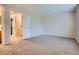 Spacious bedroom showing neutral walls, plush carpeting, and a view of the en-suite bathroom at 21767 Silver Meadow Ln, Parker, CO 80138