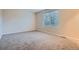 A bright bedroom with a window and wall-to-wall carpeting at 21767 Silver Meadow Ln, Parker, CO 80138