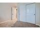 This bedroom features neutral carpet, a double-door closet and ample sunlight at 21767 Silver Meadow Ln, Parker, CO 80138