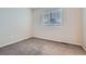 Empty bedroom featuring carpet and a window with blinds that provide natural light at 21767 Silver Meadow Ln, Parker, CO 80138
