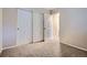 Bedroom featuring carpeted floors and closet space with sliding doors at 21767 Silver Meadow Ln, Parker, CO 80138