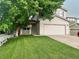 Charming two-story home with attached garage and a well-maintained front yard at 21767 Silver Meadow Ln, Parker, CO 80138