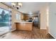 Cozy kitchen with stainless steel appliances, wooden cabinets, and dining area at 21767 Silver Meadow Ln, Parker, CO 80138