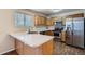 Well-equipped kitchen featuring stainless steel appliances, oak cabinets, and countertops at 21767 Silver Meadow Ln, Parker, CO 80138
