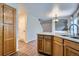 Bright kitchen showcasing wood cabinets, countertops, and a seamless transition to the dining area at 21767 Silver Meadow Ln, Parker, CO 80138