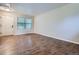 Bright living room features hardwood floors, neutral walls, and a large window at 21767 Silver Meadow Ln, Parker, CO 80138