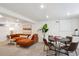 Finished basement featuring a large sectional couch, dining area, and recessed lighting at 2683 Bellaire St, Denver, CO 80207