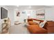 Finished basement with carpet, sectional couch, and entertainment area at 2683 Bellaire St, Denver, CO 80207