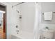 Bathroom with white subway tile and shower-tub combination at 2683 Bellaire St, Denver, CO 80207